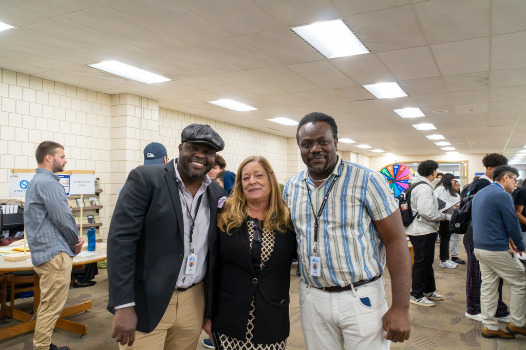 A Haitian Creole interpreter helps a student with paperwork during the 2025 MHS reality fair.