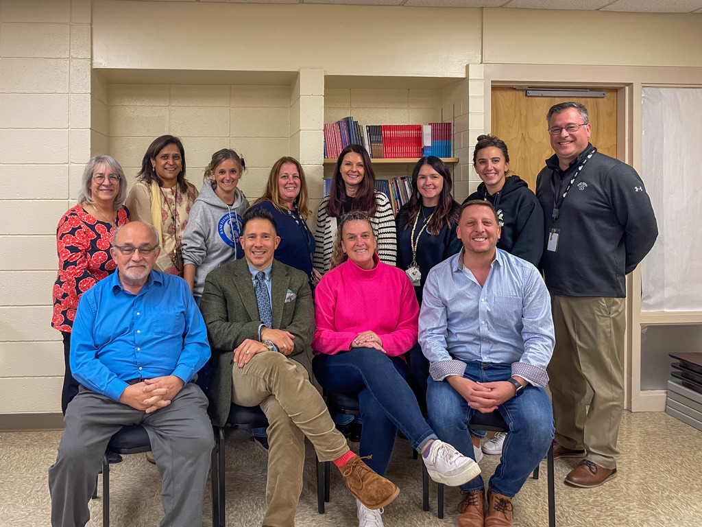 The seven MPS principals and five Marlborough School Committee members smile for a group photo.