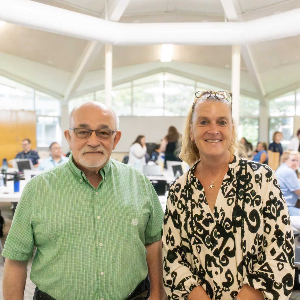 Two Marlborough School Committee members pose for a group photo in the Whitcomb Commons.