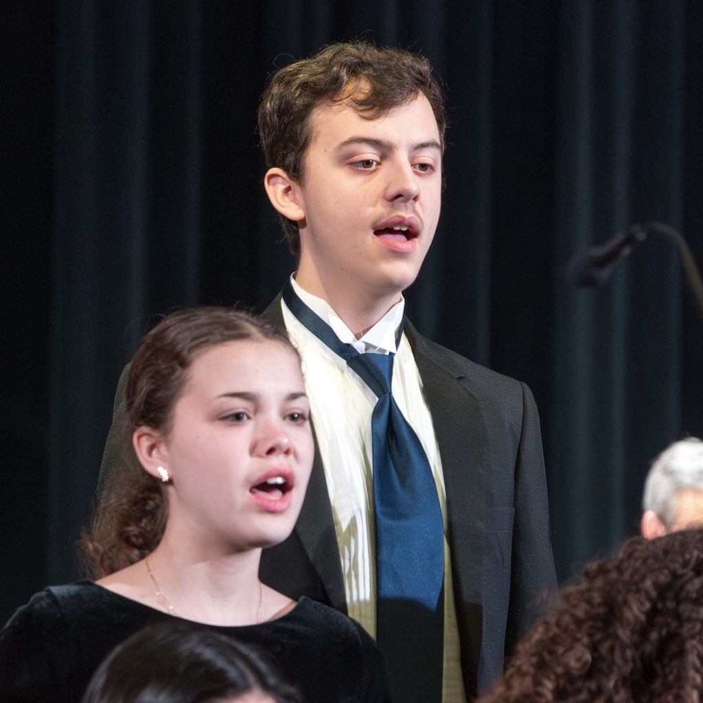 Two Voices ReChoired members singing.