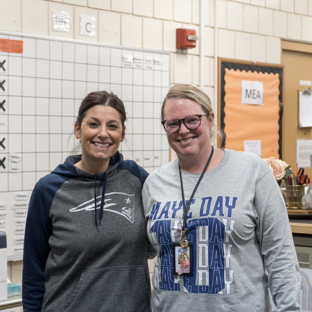 Two Marlborough High School staff members wearing Patriots gear.