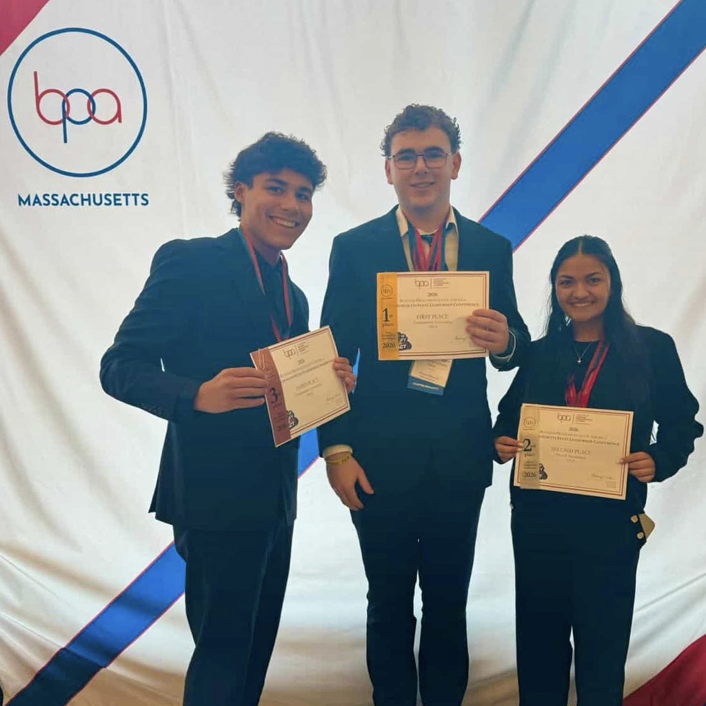 Three MHS BPA club members in suits each hold a certificate, standing in front of a blue, red and white backdrop with the BPA logo.