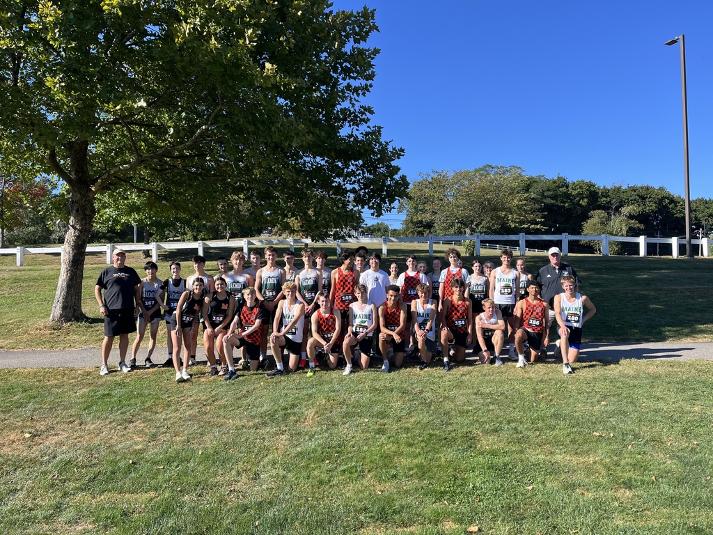 MHS Cross Country Team photographed with Coach Ed Hutch MHS alumni