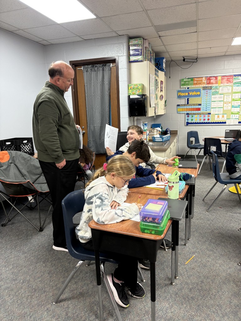 Superintendent Marshall reading to 4th  grade