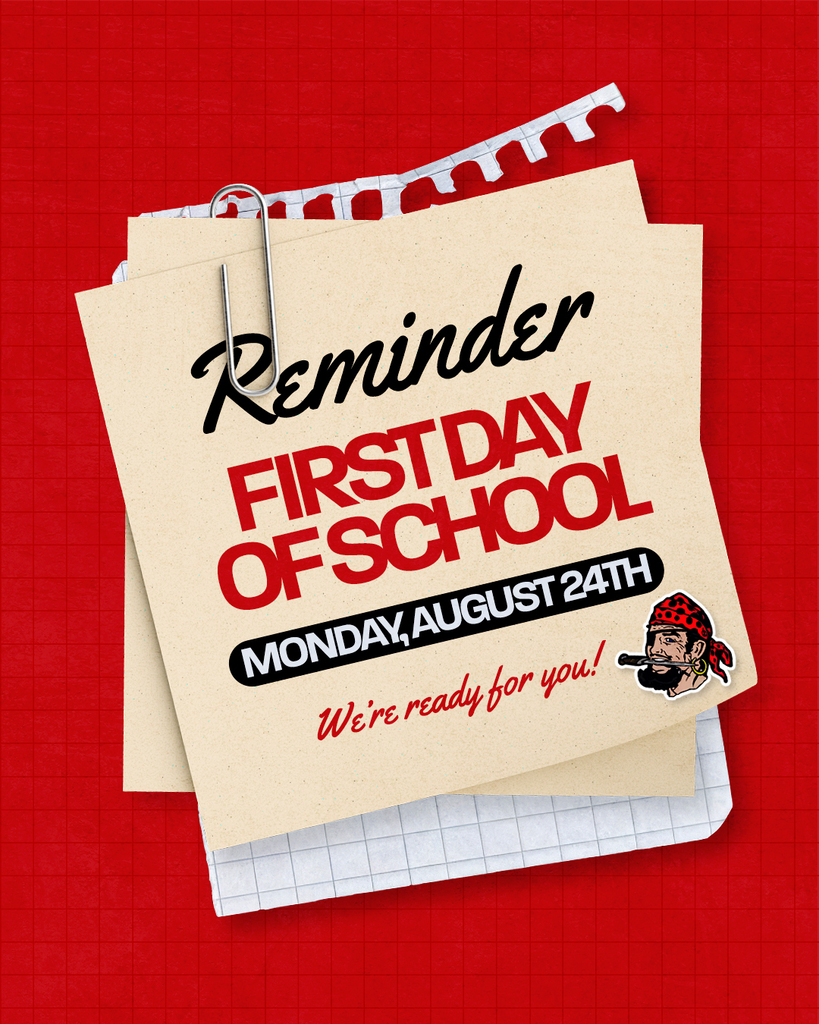 The graphic features a red school-themed background with layered sheets of paper and a large paperclip, creating a scrapbook-style design. The main message reads “Reminder: First Day of School — Monday, August 24th,” with the phrase “We’re ready for you!” and a small pirate mascot graphic near the bottom.