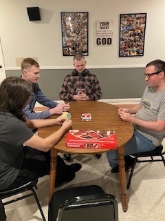Students playing games with clients at Diane's Boarding Home 2.
