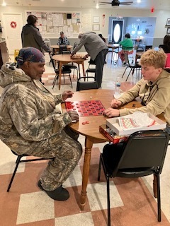 Students playing games at Diane's Boarding Home 2.