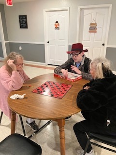 Students playing games at Diane's Boarding Home 2.