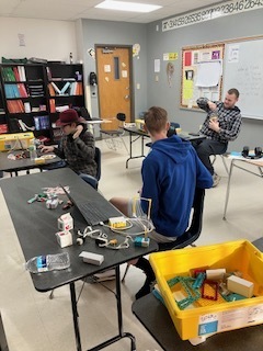 Students building robotic Legos