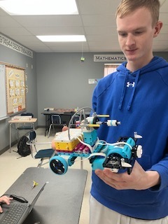 Students building robotic Legos