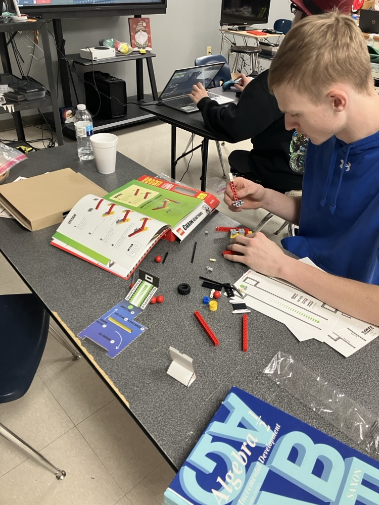 Student building chain reaction .