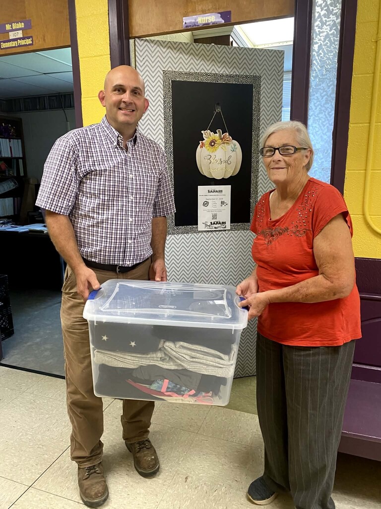 Nurse Kathy receiving clothing donation.