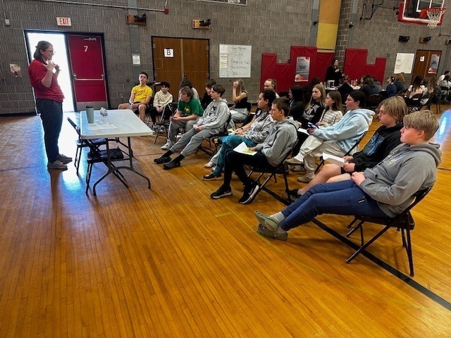 students listening to professionals talk about their jobs in the BMS gym