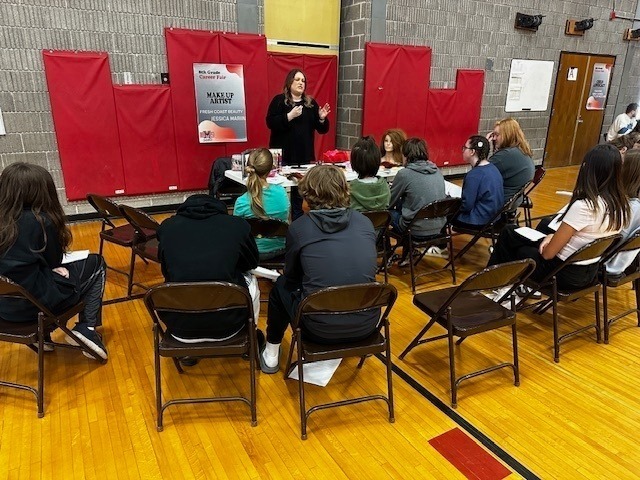 students listening to professionals talk about their jobs in the BMS gym