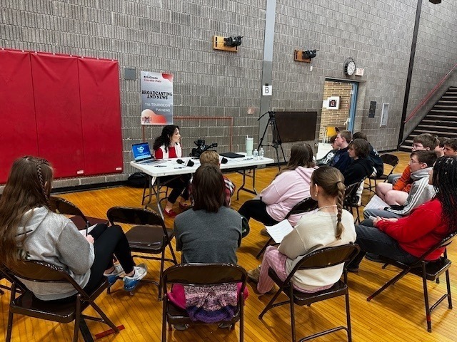 students listening to professionals talk about their jobs in the BMS gym