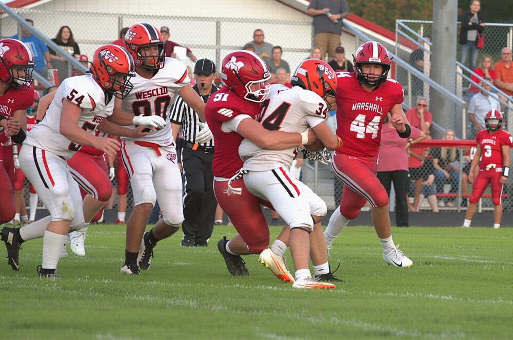 Josef Stafford (51) and Rocco Giannavola (44) led the Lions defense in their season-opening win