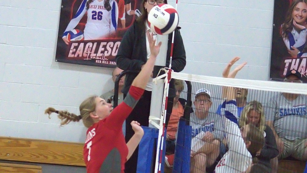 Ellie Delp goes up for the tip (photo by T Ray Henry)