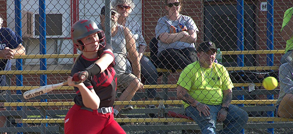 Katelyn McNeely smacks a single to left to bring home two runs for Marshall