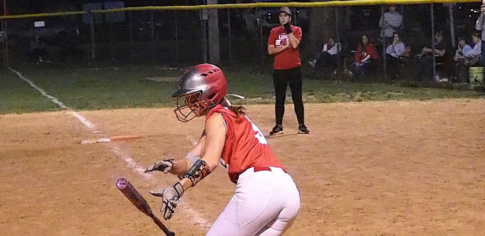 Lauren English bunts safely for a single against Robinson