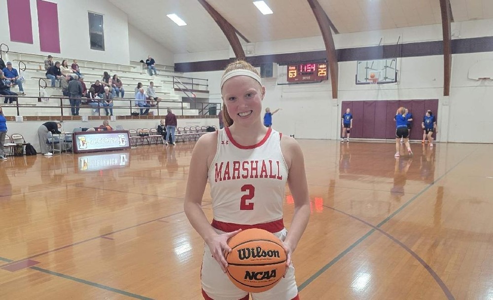 Lynn Welborn scored received the game ball after scoring her 1000th career point