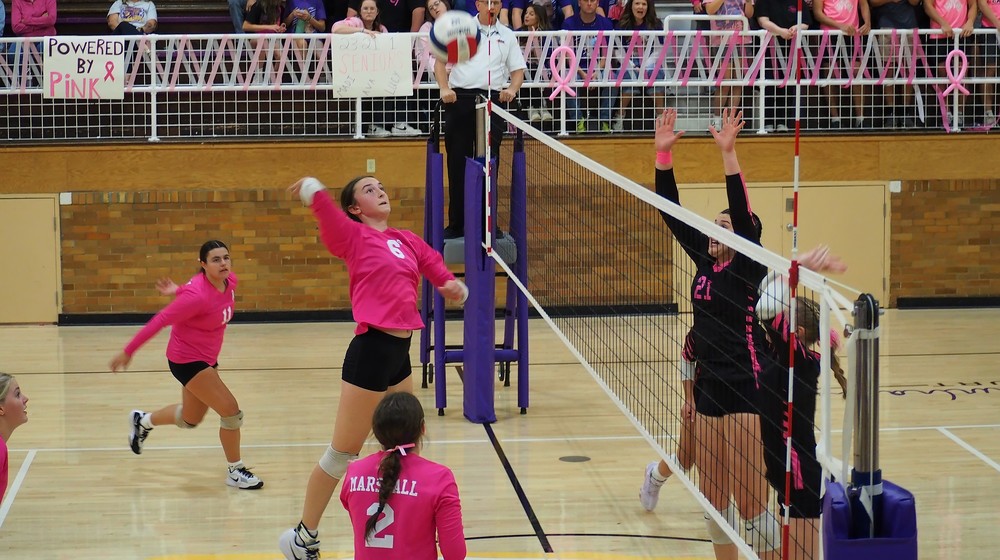 Lilly Ross goes up for the kill through the C-W block