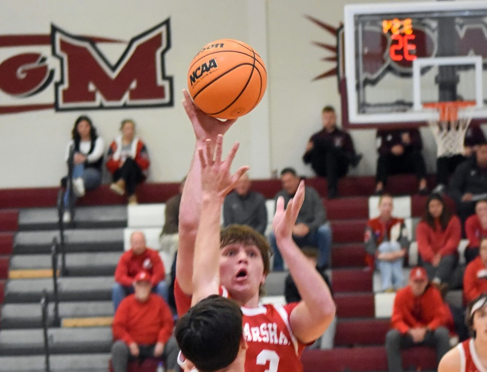 Liam Keim (3) goes up inside and scores for Marshall