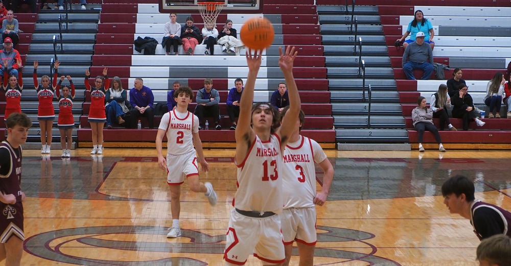 Payton McGuire (13) made 14 free throws against Mount Carmel on his way to scoring a team-high 24 points in the Lions' win