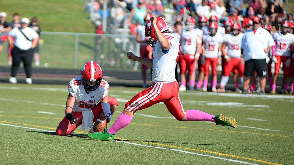Billy Guillemette (9) drills the extra point for Marshall against Lawrenceville in the Lions' big win