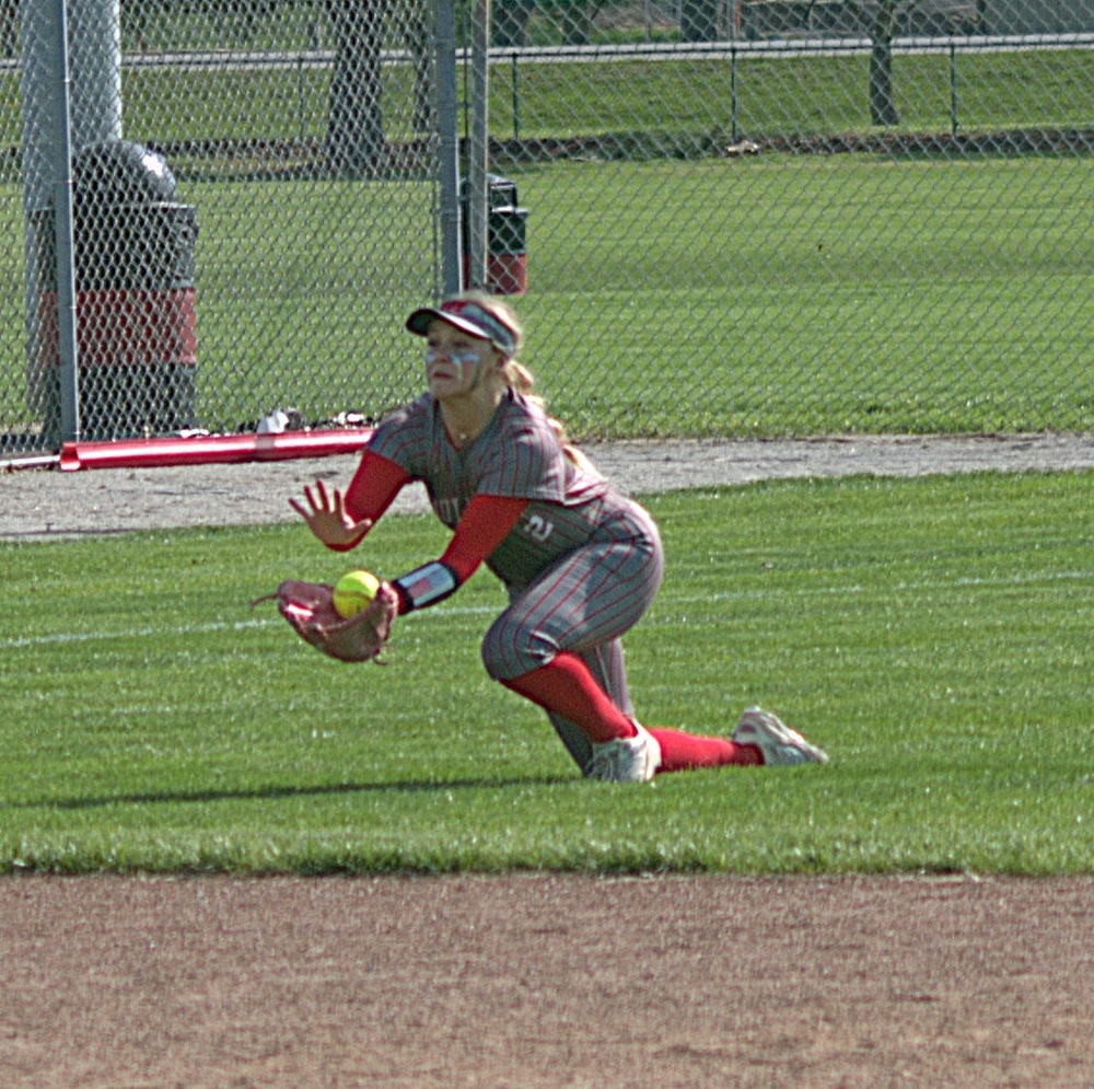 Lilly Nickles makes a diving catch of a ball against Terre Haute South