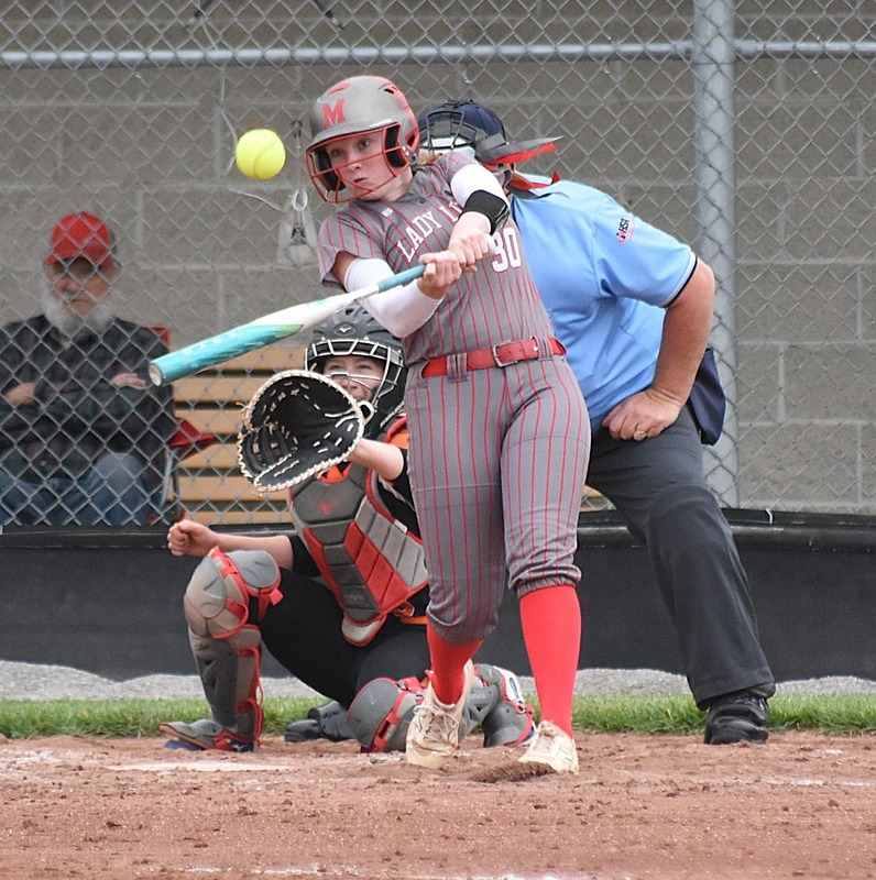 Lynn Welborn smashes this pitch over the fence against Paris for her 30th career homer