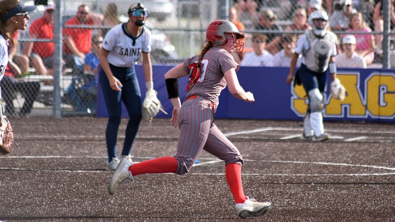Lynn Welborn, who scored two runs for Marshall, races around second base on a triple against BCC