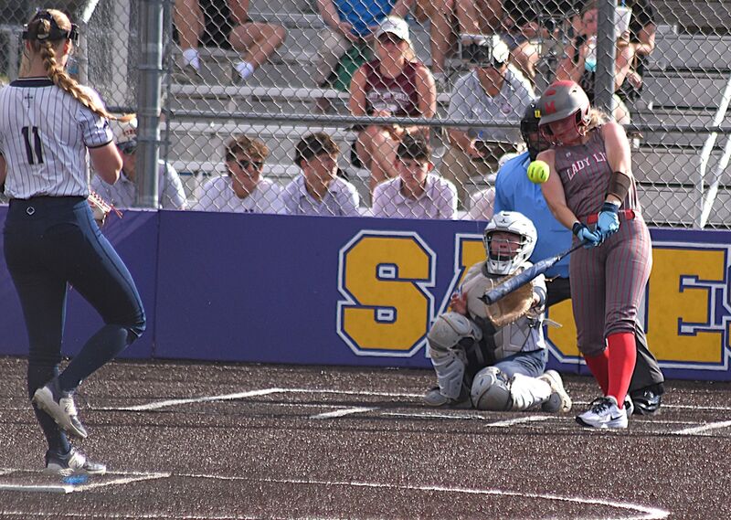 Avery Cornwell knocks a blast to the fence on the fly for a double against BCC in the sectional semifinal
