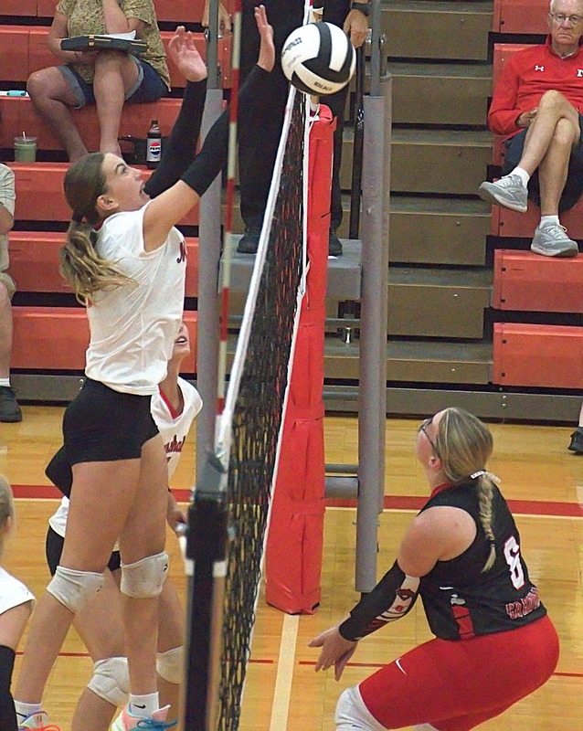 Libby Huisinga scores at the net