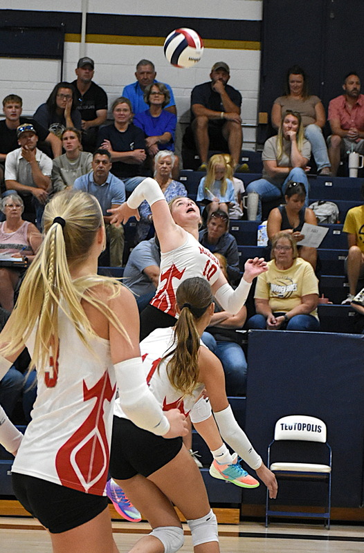 Ellie Delp (10) strikes a kill for Marshall against T-Town