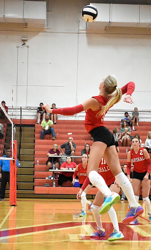 Harper Richardson (3) strikes through the Dieterich block for a Marshall point