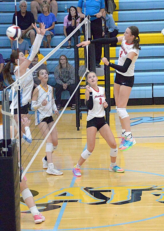 Lilly Ross (2) strikes the ball after a Harper Richardson (#3) set