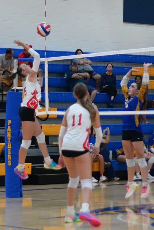 Marshall's Lauren English (5) strikes from the left side against Oblong