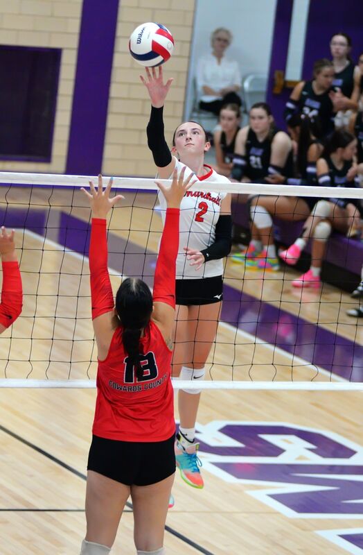 Lilly Ross (2) tips the ball over the Edwards County block during Marshall's win