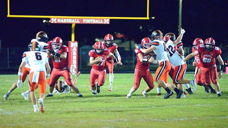 Great blocking by Marshall opens up a big hole for Wyatt Geltz (47) against Richland County