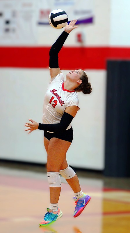 McKenzie Davis serves the final point of the match between Marshall and Martinsville won by the Lions in three sets