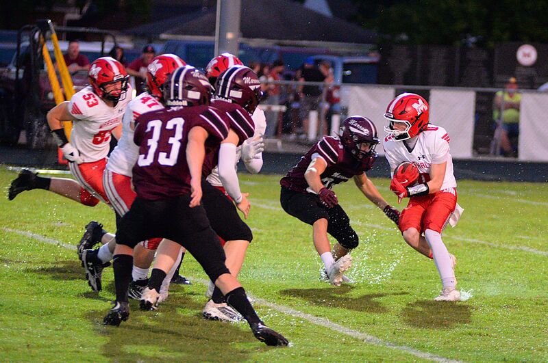 Marshall's Silas Dean hydroplanes through the grass against Robinson during the Lions' big win