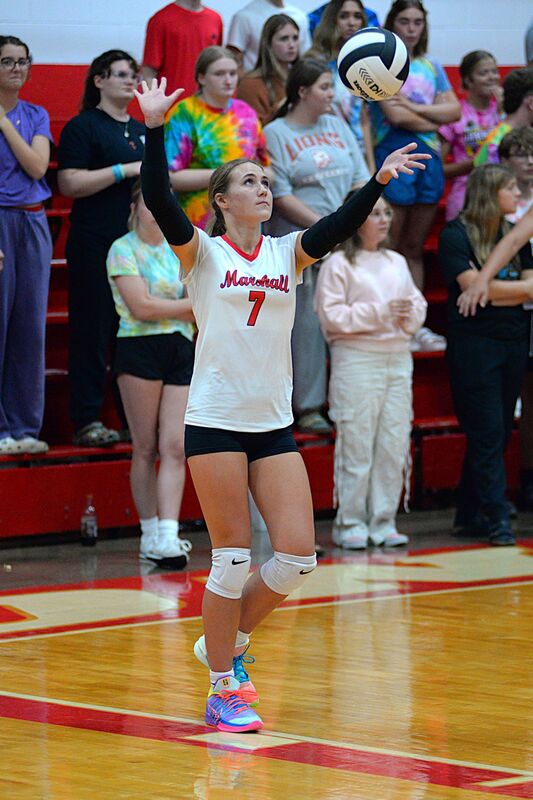 Marshall's Lily Shotts serves an ace at match point for the Lions to complete the sweep of Hut-Pal