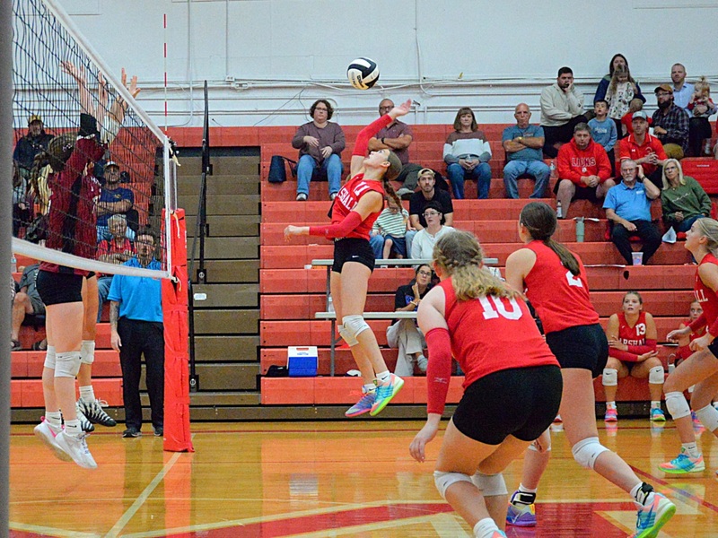 Libby Huisinga (11) scores a kill for Marshall versus Robinson