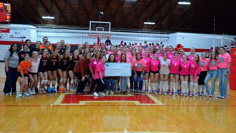 Paris and Marshall volleyball teams each receive a donation from Horizon Health on Pink Out Night