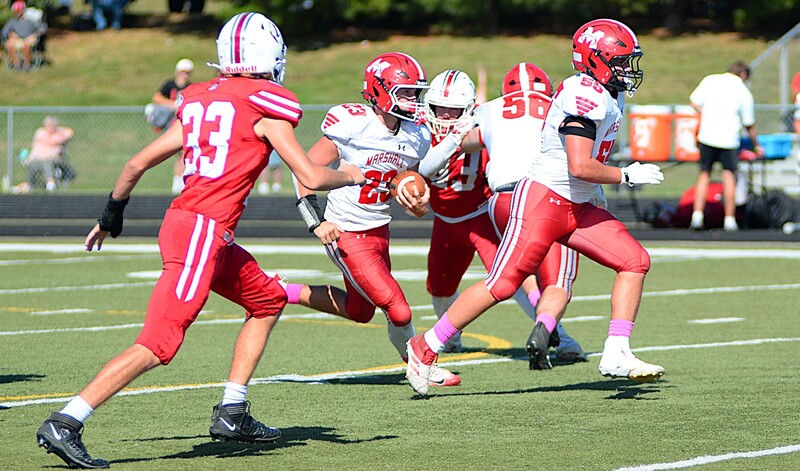 Max Welsh (23) ran for 214 yards and 5 TDs against Lawrenceville in Marshall's 60-8 win