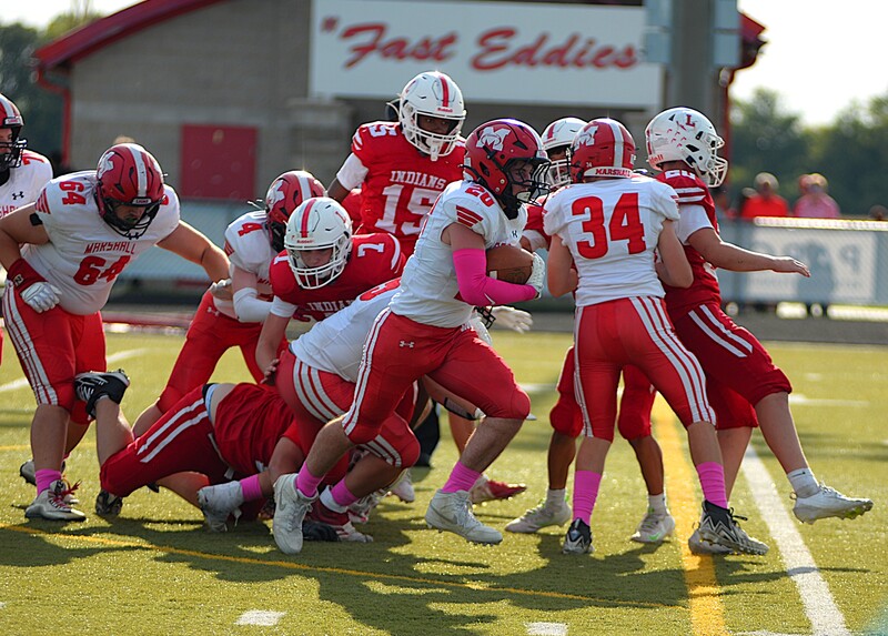 Cooper Danke (20) finds daylight during one of his two touchdown runs against Lawrenceville