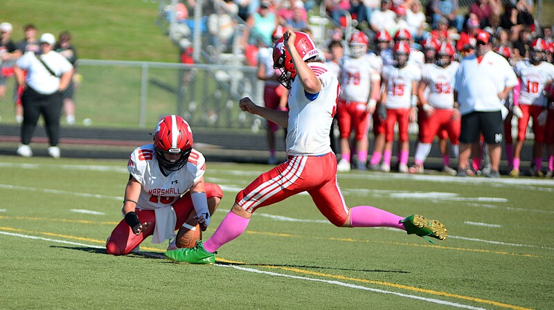 Billy Guillemette (9) drills the extra point for Marshall against Lawrenceville in the Lions' big win