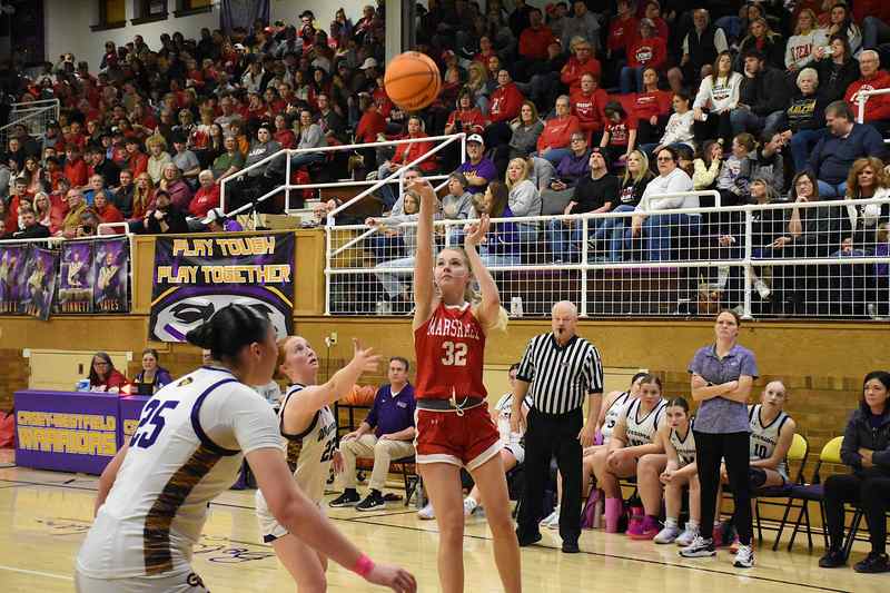 Harper Richardson (32) scores from the outside for Marshall on Mega Night