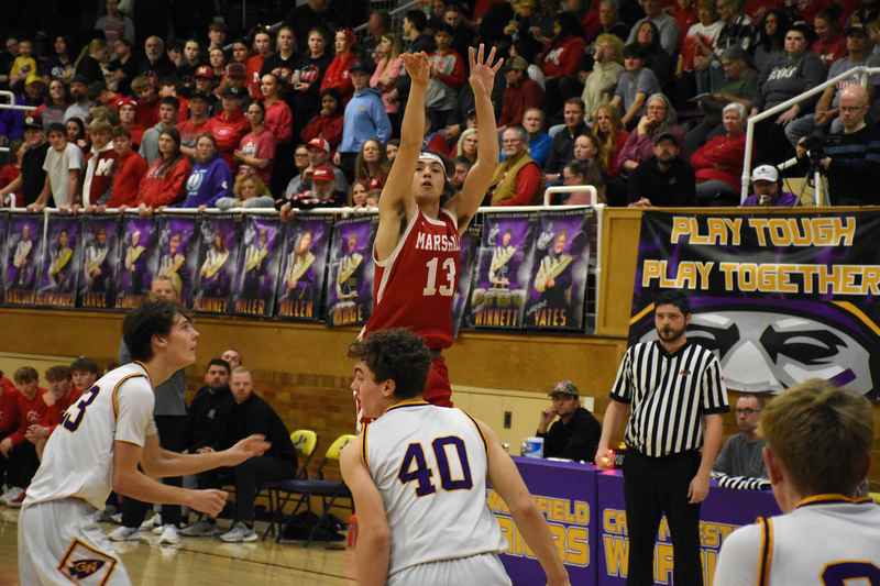 Payton McGuire (13) led the Marshall boys varsity squad with 19 points on Mega Night