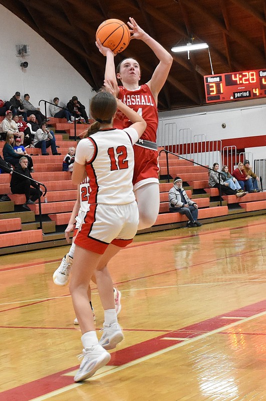 Marlee Heighton rises up over the Lawrenceville defender to score for Marshall